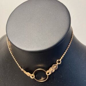 bracelet or anklet chevron links & circular pendant. delicate gold-toned chain